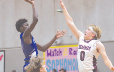 Nathan Henke goes up to block a shot by Rice’s Robert Barnett. Chuck Grafe/Tribune-Herald