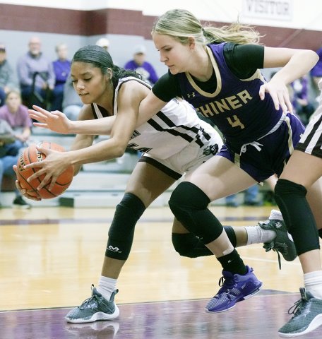 Aimee Mitchon battles to win the ball back from a Flatonia player in the first half in Flatonia on Friday. Photo courtesy of Howard Esse.