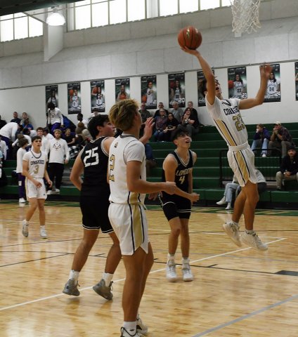 Carson Schuette leaps up for a bucket against Corpus Christi London on Thursday afternoon. He had 18 points in the book for this game. Photo by Mark Lube.