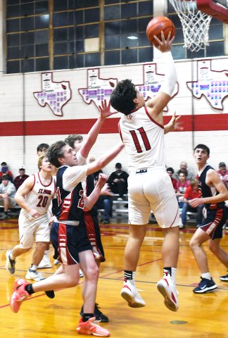 Sam Perez makes a jump shot in the first half against Cedar Park Summit. He scored 10 points as St. Paul won 57-24. Photo by Mark Lube.