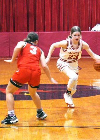 Skylar Mozisek dribbles past a Pflugerville Concordia player during the Lady Cardinals’ 67-18 win Thursday at home. Mozisek scored four points. Photo by Mark Lube.