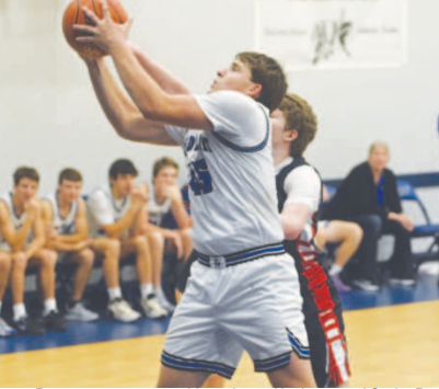 Lance Barton comes away with a rebound in the rout of Cedar Park Summit. Chuck Grafe/Tribune-Herald