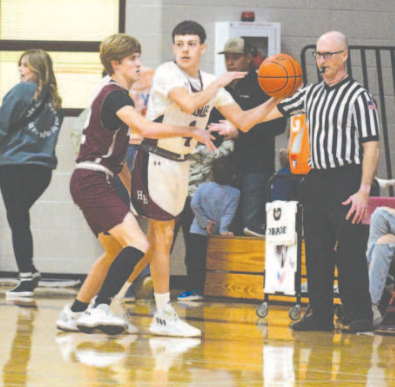 Trey Satterwhite looks for an open teammate during the 54-34 victory over Industrial here Tuesday, Jan. 9. Chuck Grafe/Tribune-Herald