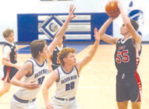 Brody Etzler, left, and Klayton Chance (20) defend in the Jan. 4 game with Cedar Park Summit. Chuck Grafe/Tribune-Herald