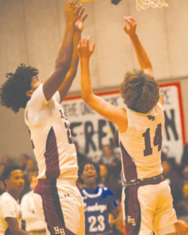 Kason Podhajsky (14) and Jorian Wilson have their eyes on a rebound. Chuck Grafe/Tribune- Herald
