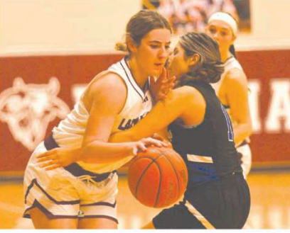 Haven Drozd works her way around a Yoakum Defender in the 4th quarter.