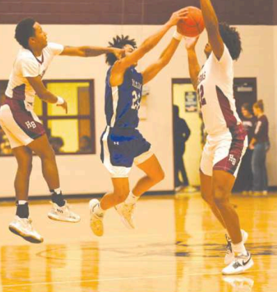Jashaun Price, left, and Jordan Wilson harass Yoakum's Elyas Garza.