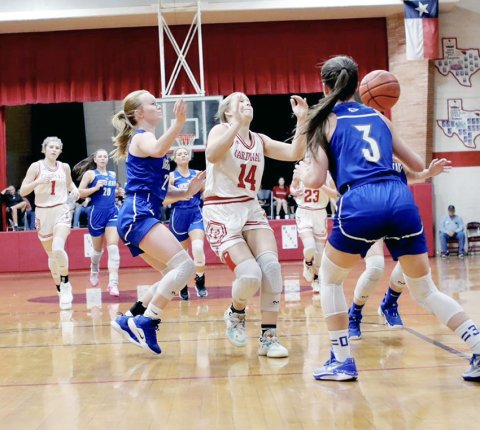 Avery Pesek sends off a pass against Sacred Heart on Thursday. She scored 10 points in the Feb. 6 game at Pflugerville Concordia. Photo courtesy of Louann Heinsohn.