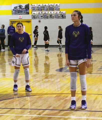 Brooke Palmer (left) and Morgan Lenehan (right) warm up prior to a recent home game. Shiner played its regular-season finale Tuesday at home to Louise. Photo by Mark Lube.