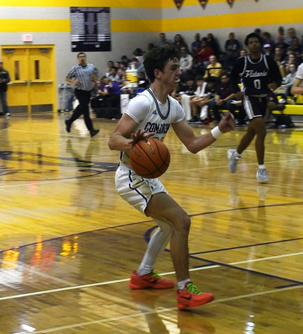 Carson Schuette charges into the paint during the second half against Flatonia on Jan. 30. The junior had one of his biggest games of the season as he hit half-a-dozen treys and scored 32 points.