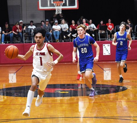 Andrewn Nunez races down the court in the first half of Thursday’s game against the Indians. Nunez finished with eight points. Photo by Mark Lube.