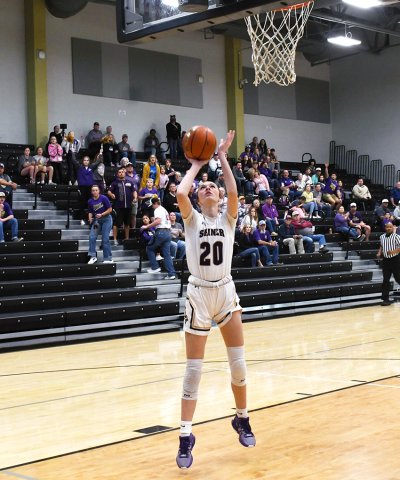 Morgan Lenehan makes a bucket attempt in the first half. The junior led Shiner with 21 points and two triples. Photo by Mark Lube.