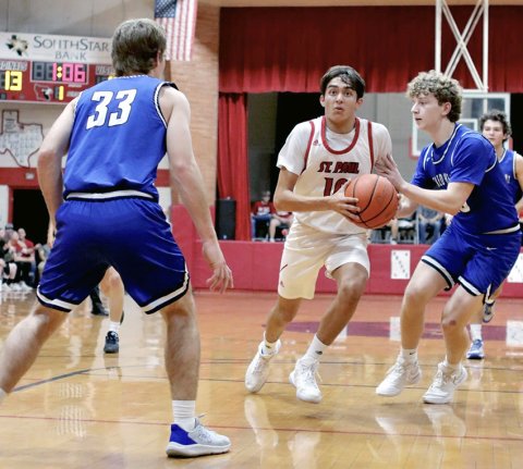 Zeke Rodriguez enters the paint Thursday against Sacred Heart. He led the Cards in the previous game at Pflugerville Concordia (Feb. 6) with 13 points. Photo courtesy of Louann Heinsohn.