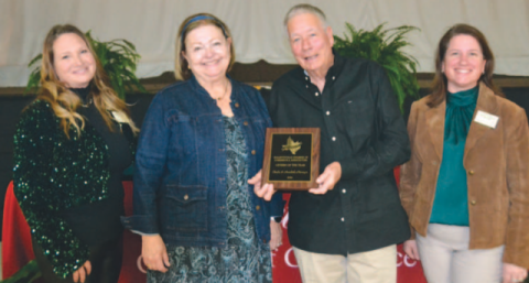 The Neumeyers — Annabeth and Charles — accept their Citizens of the Year Award from Hallettsville Chamber of Commerce and Ahriculture Directors Jennifer Hagan, left, and Christine Brown. Photo by Jimmy Appelt