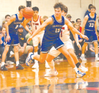 Nic Angerstein goes after a loose ball to cause a turnover in the SP game Thursday. Chuck Grafe/Tribune-Herald