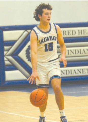 Nic Angerstein brings the ball up court in the Conroe Covenant area round victory here Tuesday, Feb 20. Chuck Grafe/Tribune-Herald