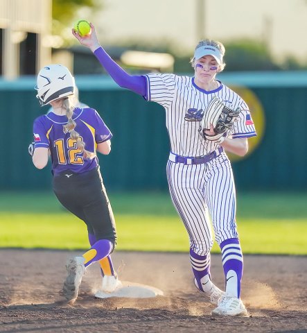 Addy Siegel tries to complete the second out of a double- play attempt against Weimar March 26 in Shiner. Photo courtesy of Howard Esse.