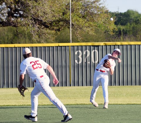 SP shortstop Jack Leonard chunks a fielded ball in the March 27 game against SH. Photo by Mark Lube.