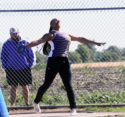 Nevaeh Jones flings the discus Thursday morning in Thrall. She placed second to advance to the regional meet with a throw of 115 feet, 3 inches. Photo by Mark Lube.