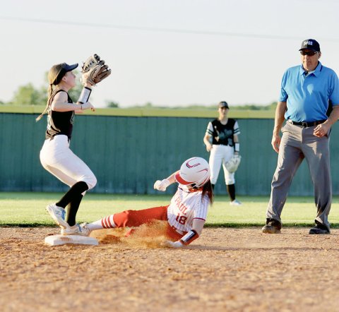 Samantha Moeller successfullly  slides into base against Austin Brentwood April 11. Photo courtesy of Louann Heinsohn