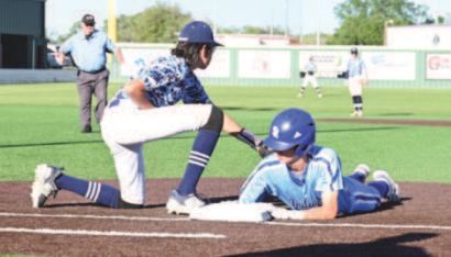 Hudson Kutac gets back to first in the first inning of the game with Bracken Christian. Chuck Grafe/Tribune-Herald