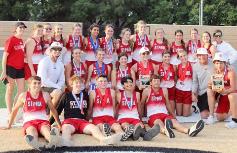 The St. Paul girls and boys track teams along with coaches Emily Mieschen, Nicco Brown, Ryan Geiger and Jake Wachsmuth gather for team photo after the regional meet Friday in Seguin.Not shown are coaches Emma Mikulik and Karli Rodriguez. Photo courtesy of Jake Wachsmuth.