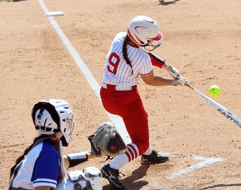 Lady Cardinals Stefany Pokluda, in her last game for St. Paul softball, had a second-inning leadoff, solo home run. Photo by Mark Lube.