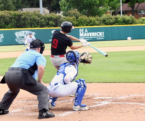 Jack Ehrig makes a cut in the state semifinal game against Sacred Heart on Friday. He scored one run. Photo by Mark Lube.  