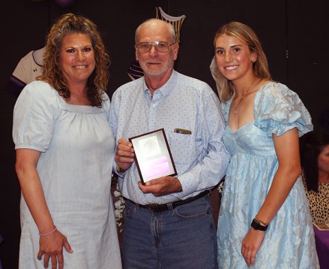 Shiner Comanche Fan of the Year, Howard Stridde (middle). Also shown is Cari Lynn Siegel (left) and Addy Siegel (right). Photo by Mark Lube.