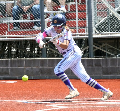 Brinley Ramirez attempts to lay down a bunt. She got one hit and scored three runs in the second game. Photo by Mark Lube