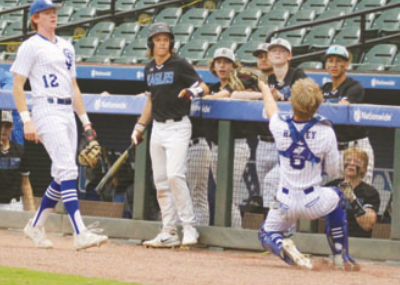 Indian catcher Emerson Harvey makes a great catch in from of the Brazosport Christian as first baseman Wade Shimek looks on.. Lisa Noska for the Tribune-Herald.