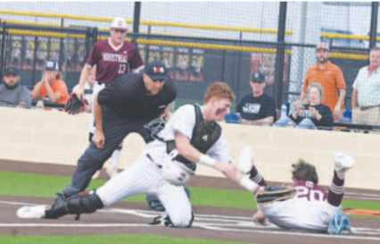 Carter Blaha could not get the tag down on time on Industrial’s Sam Kurtz. Chuck Grafe/Tribune-Herald