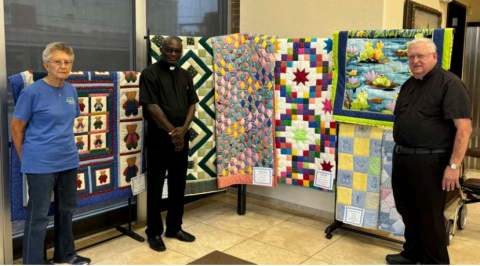 Pictured: Charlene pillow, Fr. John Affum, Monsignor John Peters