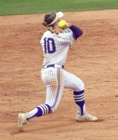 Third baseman Kailey Boedeker winds up for a throw to first in the state semifinal against Crawford. Photo by Mark Lube.