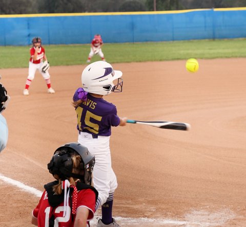 Adella Davis takes a swing during Shiner 8-year-old softball  All-Stars game against Hallettsville on June 3. Photo by Mark Lube.