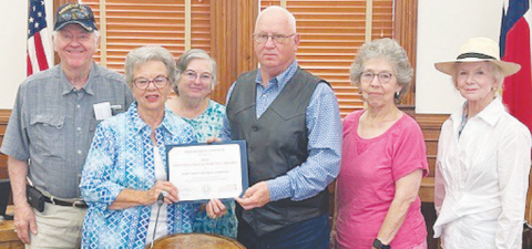 DeWitt County Commissioners present a Distinguished Service Award to the Texas Historical Commission. Pictured from left to right are Texas Historical Commissions member Larry Knuckles, Chairman Peggy Ledbetter, member Barbara Knuckles, Precinct 2 Commissioner James Pilchiek Sr., and members Patricia Muir and Betty Burda.
