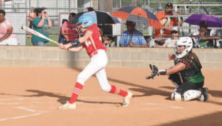 Morgan Felcman puts the ball in play in the July 1 victory of Refugio County. Chuck Grafe/Tribune-Herald