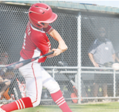 Tanner Pustka puts the ball in play vs. Beeville. Chuck Grafe/Tribune-Herald