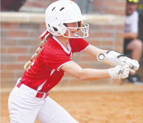 Chloe Grahmann puts down a sacrifice bunt in the Silsbee game. Chuck Grafe/Tribune-Herald