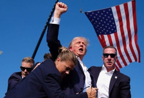 Seconds after a potential assassin’s bullet came within millimeters of former President Donald Trump’s head at a Pennsylvania political rally Saturday, an angry, blood-streaked Donald Trump defiantly raised his fist to the crowd, yelling “Fight. Fight. Fight!” as Secret Service members surrounded him and hurried him offstage to safety.  The shooter, Thomas Matthew Crooks, 20, of Pennsylvania, was gunned down by Secret Service agents. Photo by the Daily Beast