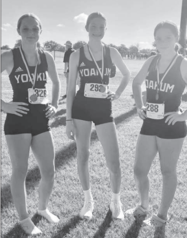 Yoakum Cross Country Lady Bulldogs with medals from meet on Aug. 17. Contributed photo.