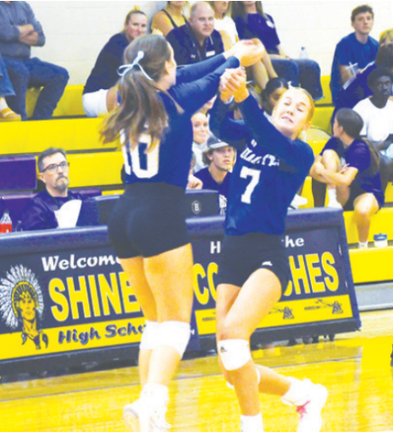 Emma Demel (10) and Rylan Dworsky (7) converge on the ball. Mark Lube/Shiner Gazette
