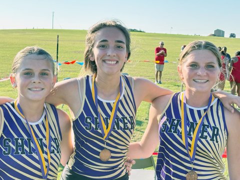 All three Shiner girl runners were top 10 in the 1A-2A varsity race. From left are Jewel Caka, Megan Burns and Jo Caka. Photo courtesy of Michelle Winkenwerder.