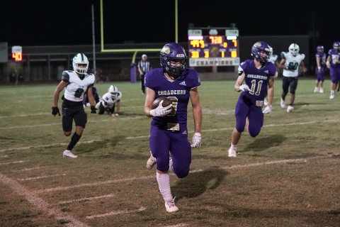 Caleb Lehnert streaks down the field with Kye Adamek (11) trails. Lehnert contributed 52 rushing yards and one touchdown against the Eagles. Photo courtesy of Photos by Lori Raabe. 