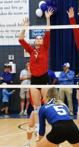 Samantha Moeller tries a block against Sacred Heart last week. Photo by Mark Lube.