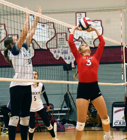 Senior Dallyn Pesek sets a ball during first set of St. Paul’s sweep over Bracken last Thursday. Photo by Mark Lube.
