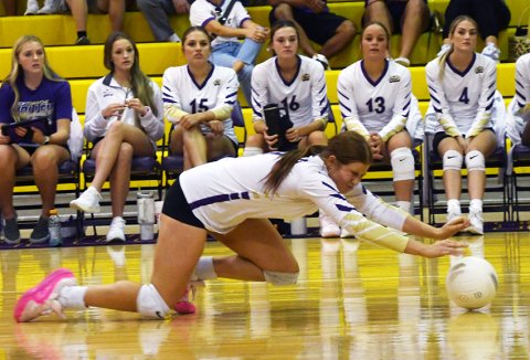 Sophomore Lexi Boner stretches to get a Fayetteville serve. She almost got it but it was just a little out of her reach.  Photo by Mark Lube.