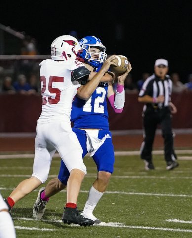 St. Paul safety Carter Chilek makes life uncomfortable for Indian quarterback Andrew Steffek on this play Friday in Hallettsville in the 28-6 win for Sacred Heart. Photo courtesy of Photos by Lori Raabe.