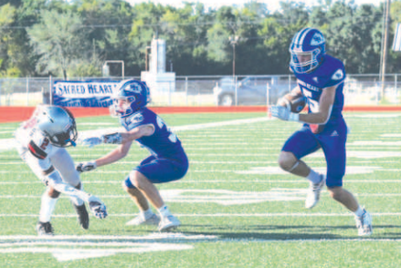 Halfback Riley Haas scored on this 12-yard run in the first quarter. Chuck Grafe/Tribune-Herald