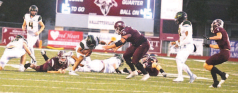 Linebacker Gage Norris (11) trips up Pirate halfback Trevor Garcia. Chuck Grafe/Tribune-Herald